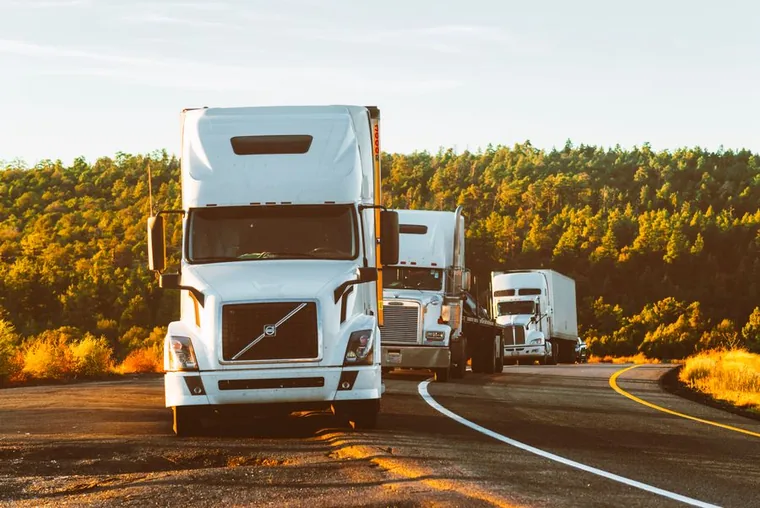 Commercial work trucks on an Ohio highway